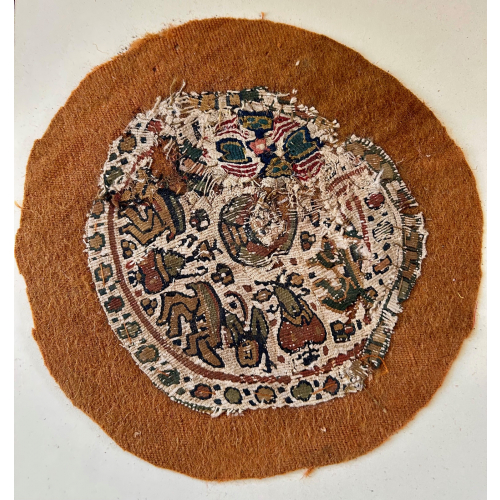 A tapestry woven Coptic roundel This is composed of two different roundels The bottom half has wonderful comic beasts. Circa 4 th - 6 th century
