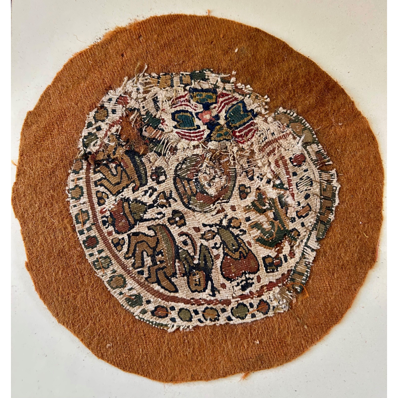 A tapestry woven Coptic roundel This is composed of two different roundels The bottom half has wonderful comic beasts. Circa 4 th - 6 th century