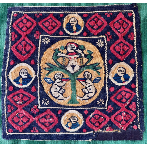 A rare Coptic Roundel Depicting a Tree of Life And confronting putti. Tapestry woven in Egypt 4th - 6 th century Measurements: Provenance: Castle Howard Collection