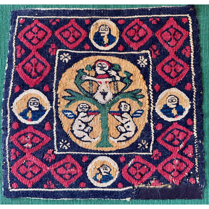 A rare Coptic Roundel Depicting a Tree of Life And confronting putti. Tapestry woven in Egypt 4th - 6 th century Measurements: Provenance: Castle Howard Collection